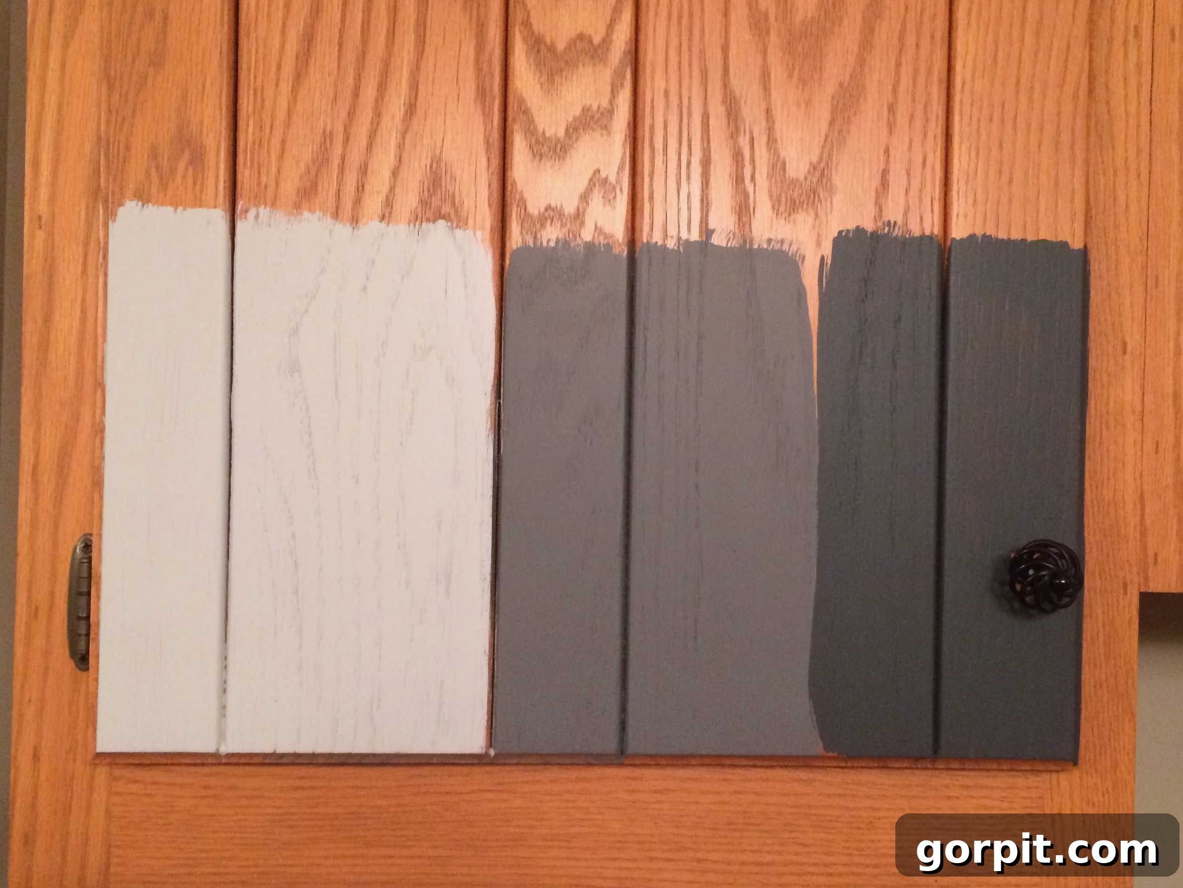 Kitchen Cabinet Painting My Three-Time DIYers Proven Process 6 image of orangey oak kitchen cabinet door with three gray paint color samples from General Finishes Milk Paint painted on it