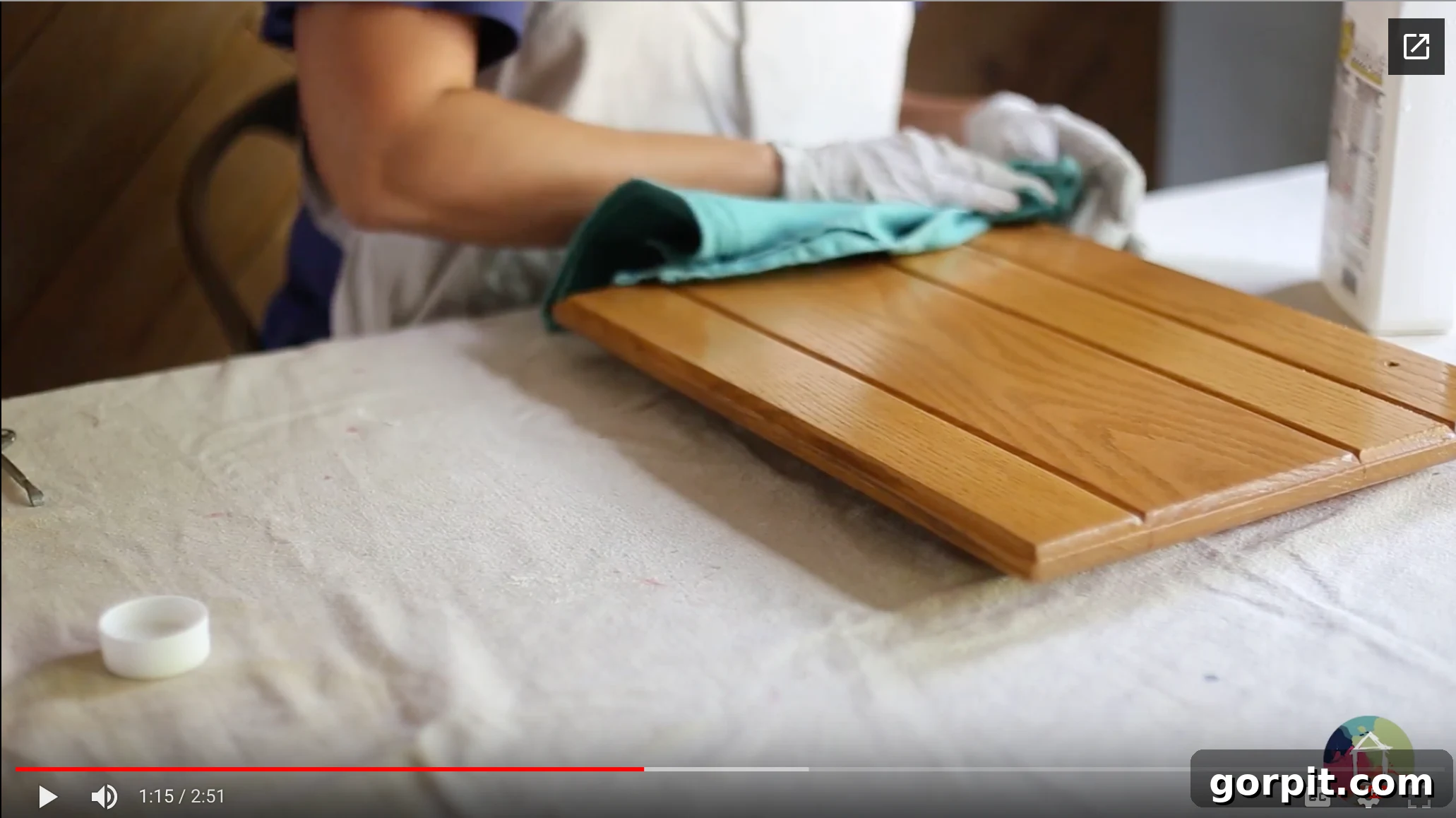Kitchen Cabinet Painting My Three-Time DIYers Proven Process 7 image of woman wearing latex gloves wiping down oak kitchen cabinet door with liquid deglosser