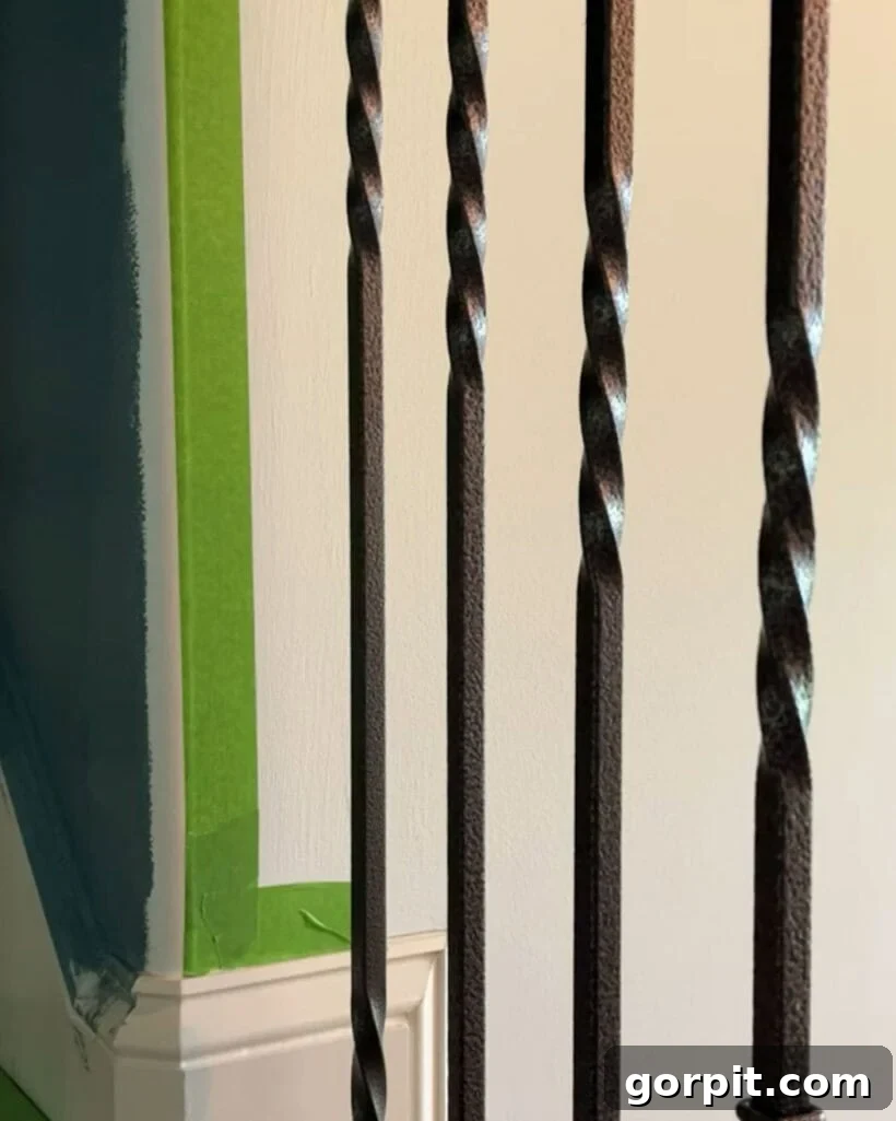 Image of painter's tape meticulously applied to a rounded corner of a wall, demonstrating the precise preparation required for painting two different colors with a clean dividing line, free from bleed-through.