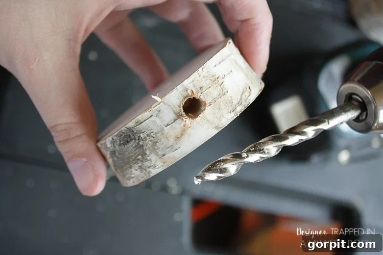 Drilling a Horizontal Hole into the Side of the Bottom Wood Slice for the Lamp Cord