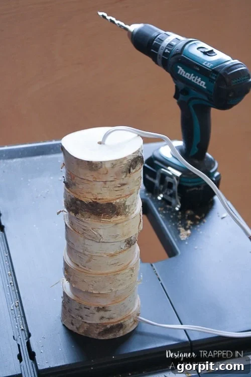 Stacking Drilled Wood Slices onto the Lamp Cord to Build the Base