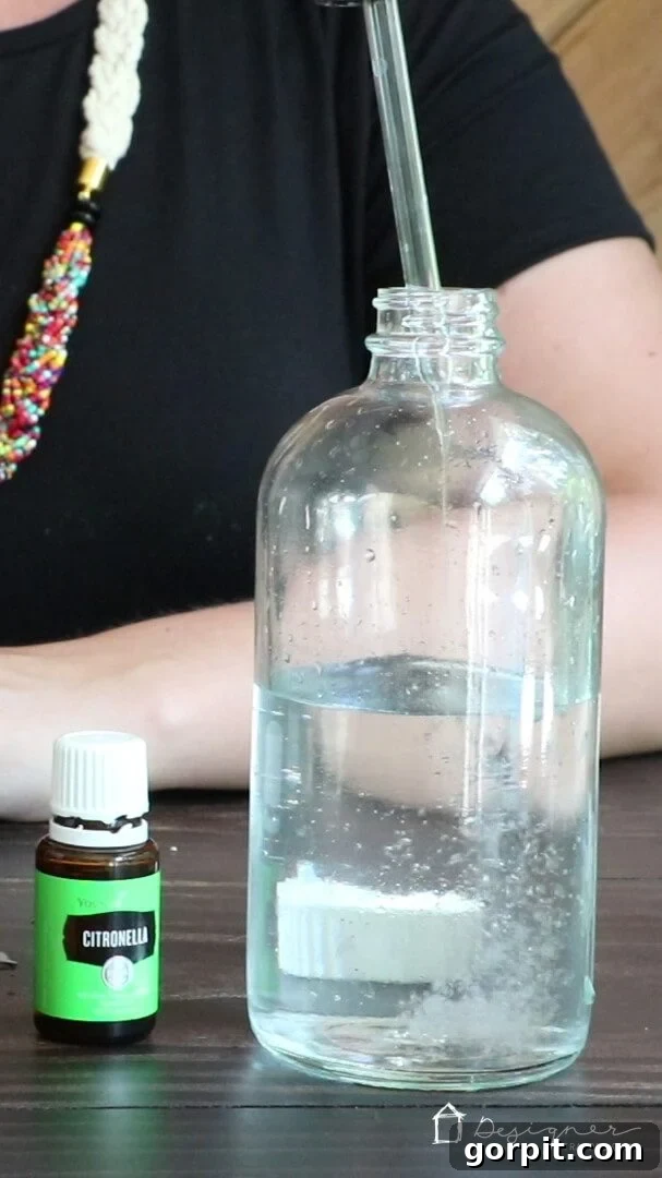 Homemade Chemical-Free Bug Defense 6 Adding essential oils like citronella, eucalyptus, and lemongrass to the DIY bug spray mixture, crucial for natural insect repulsion.