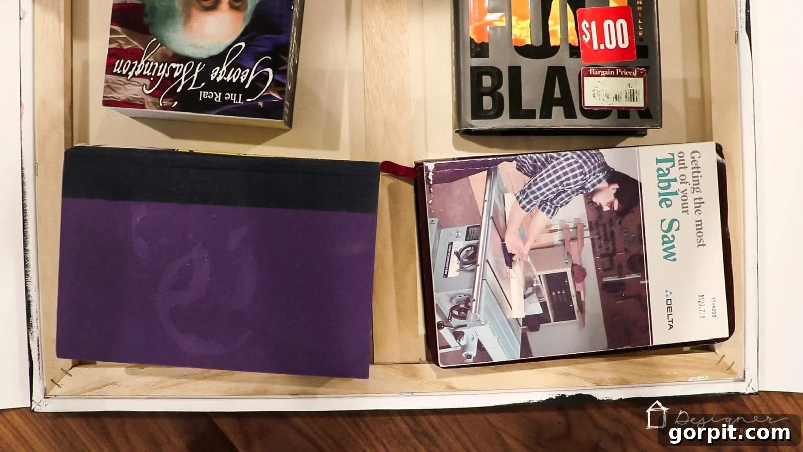 Canvas drying face down with books on top to prevent wrinkling