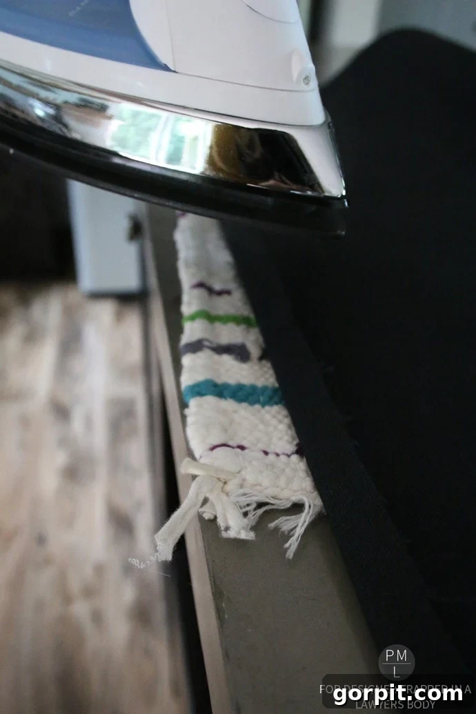 Homemade Hammock Lounger 10 Ironing the top seam of the DIY hammock chair fabric