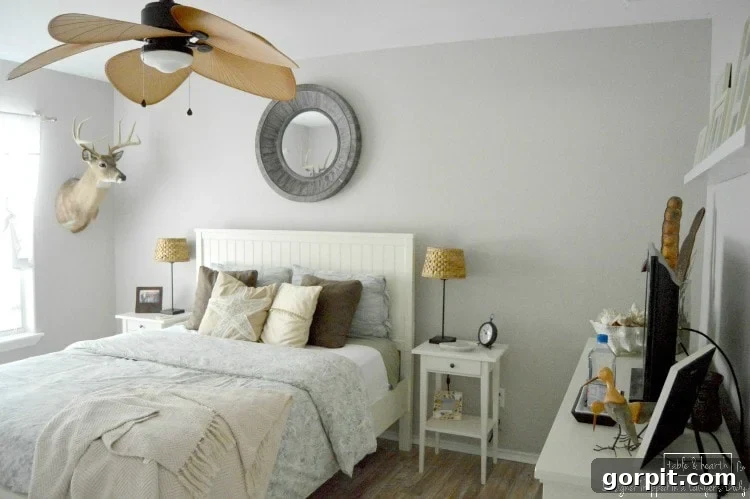 Before shot of a guest room with plain walls, awaiting a DIY wood plank wall transformation