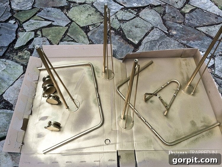 Freshly spray-painted gold Krille legs drying, ready to be assembled into a stylish IKEA hack desk for a home office.
