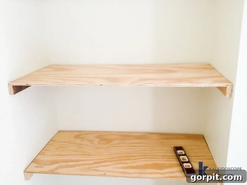 installing floating shelves and desk in corner of room