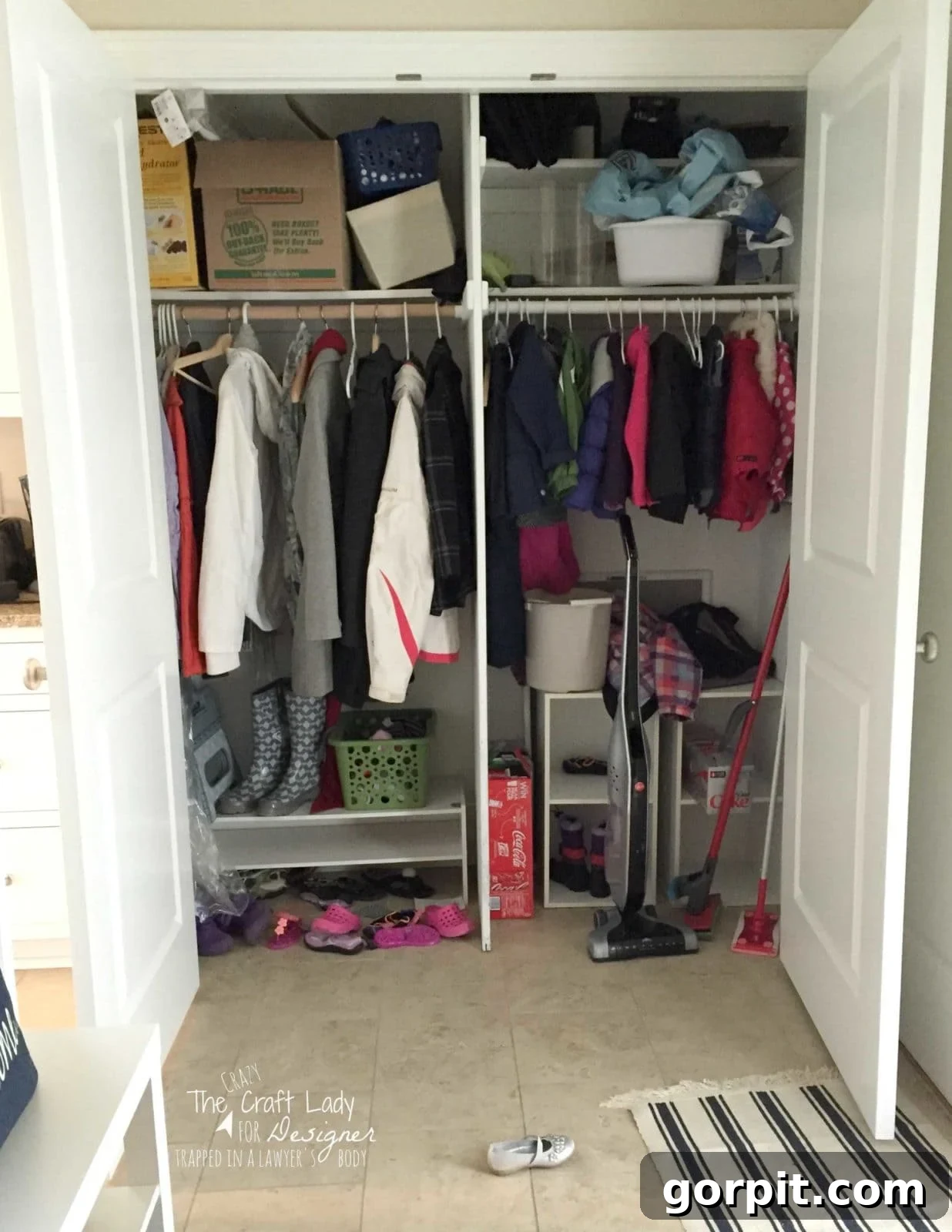 Honeycomb Shoe Rack DIY 4 A white front hall closet with both double doors open, showing fairly organized family storage, including hanging jackets, helves for shoes and boots, cleaning supplies and more. The lower left corner reads,