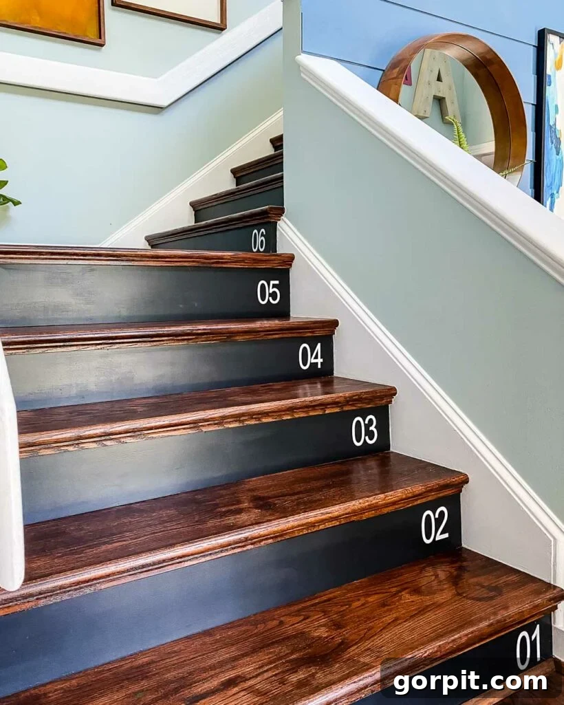 DIY Staircase Makeover: Hardwood Installation Guide 3 Beautifully updated stairs with carpet removed and new DIY wood stair treads installed, depicting the 'after' transformation.