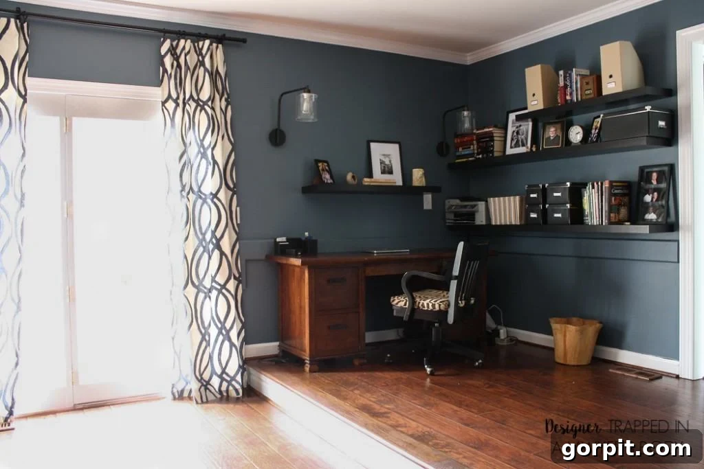 Close-up of renovated family room with hand-scraped laminate flooring, emphasizing warmth and elegance.