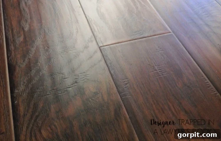 Explore the beauty and realism of modern hand-scraped laminate flooring, offering the luxurious look of hardwood at an affordable price.