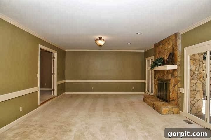 Image of an outdated family room before flooring renovation.