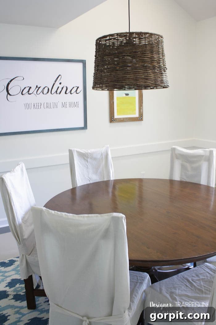 Blue and white dining room with the newly refinished table as the centerpiece.