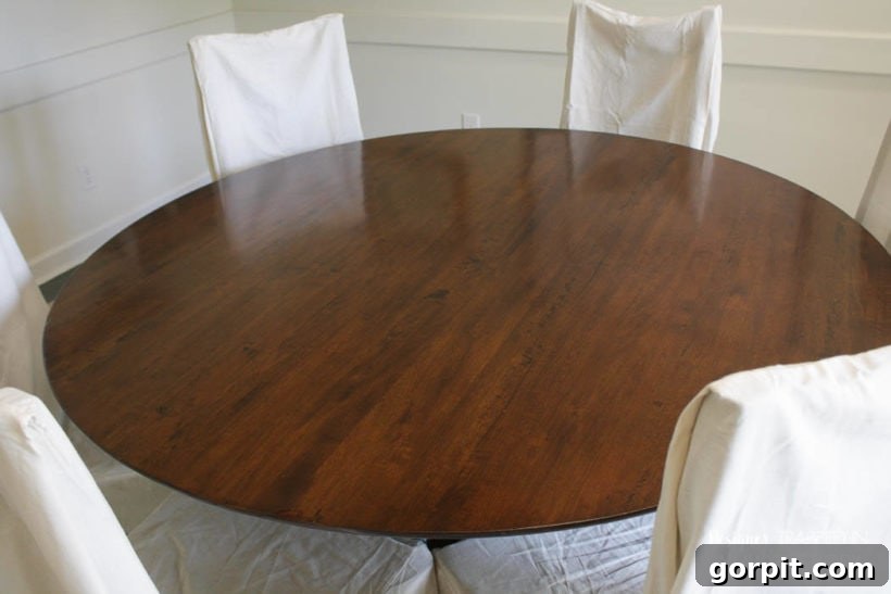 Beautifully refinished wooden table, showcasing its restored beauty and smooth finish.