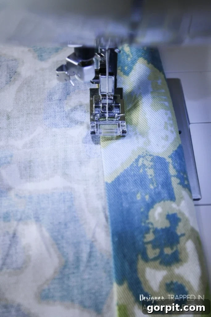 Easy DIY Curtains 7 Sewing the side hems of DIY curtains. Learn basic stitching for a durable and neat finish on your custom window treatments.