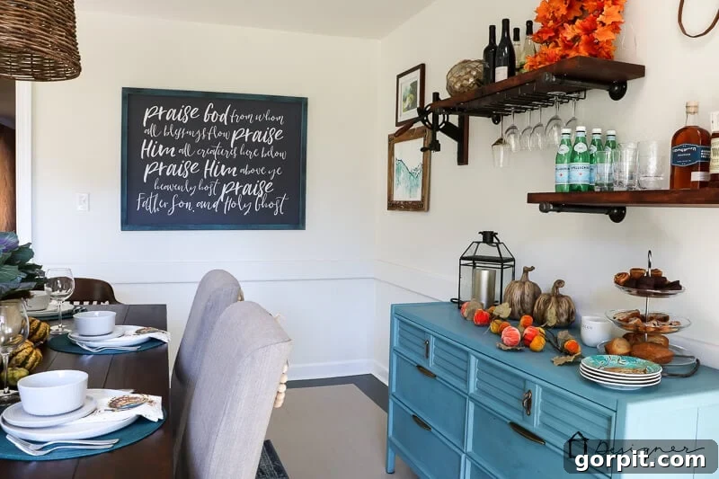 Large DIY frame with custom art brightening a dining room