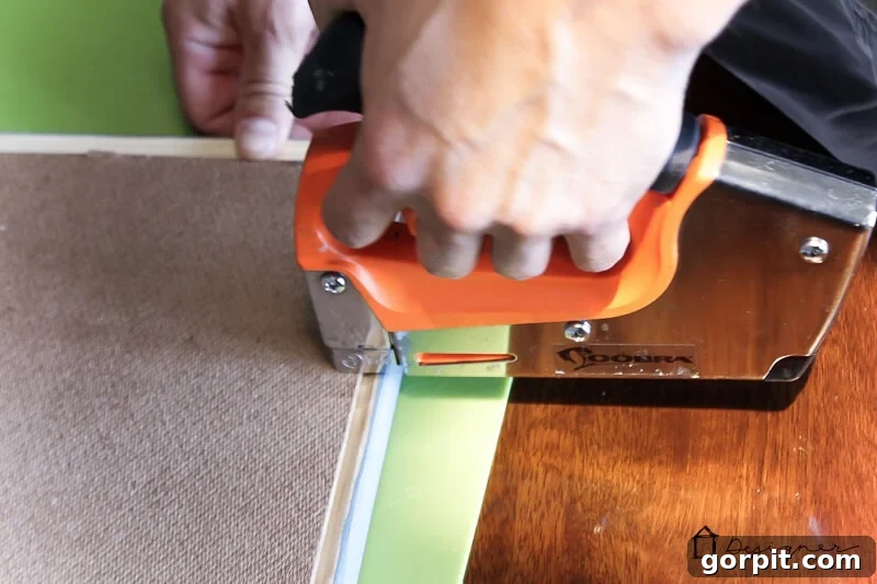 Stapling art print into DIY picture frame