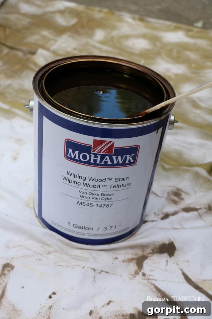 Revitalize Your Wood Chairs Effortlessly 10 Applying Mohawk Wiping Wood Stain to an antique chair seat with a foam brush