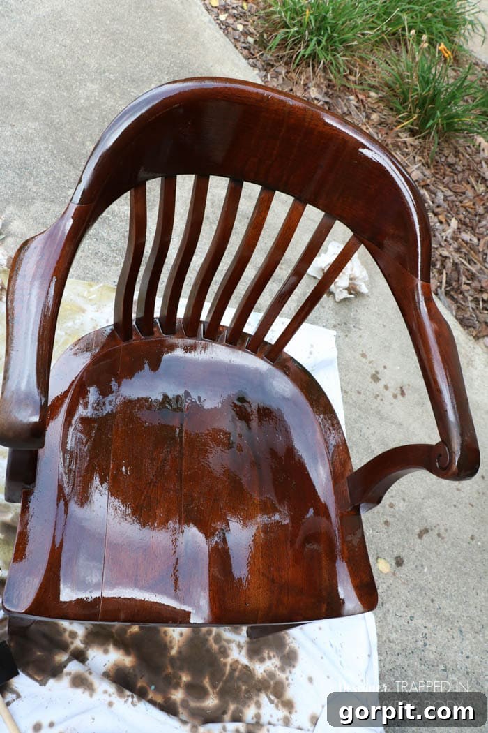 Revitalize Your Wood Chairs Effortlessly 12 Applying a second coat of Mohawk Wiping Wood Stain to an antique wood chair