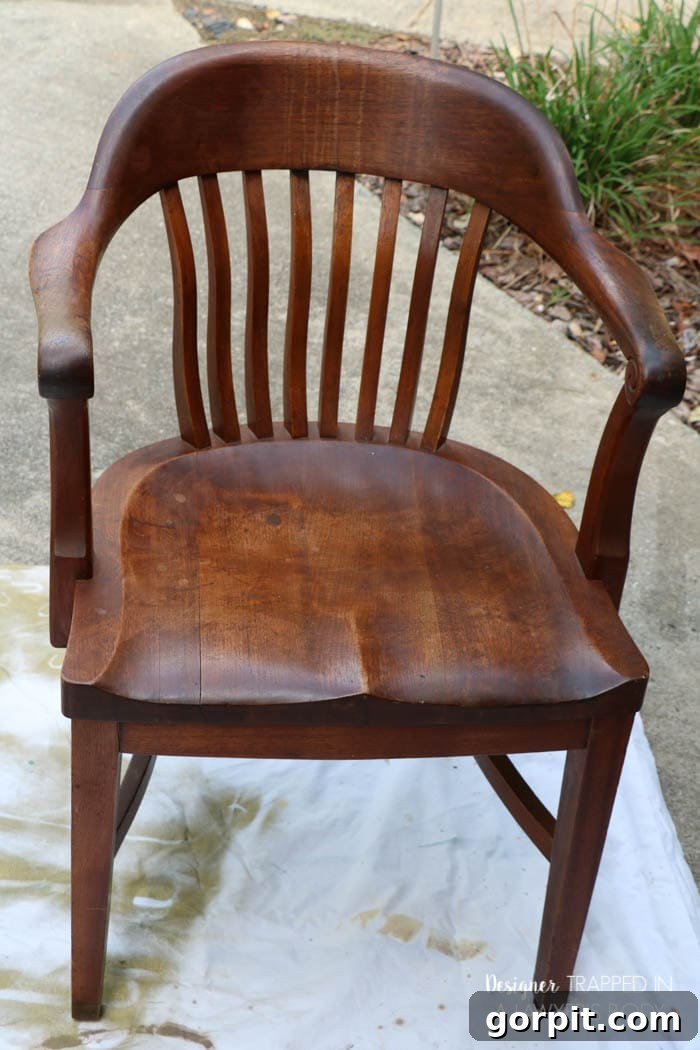 Revitalize Your Wood Chairs Effortlessly 5 Before photo of a wood chair back with noticeable drip marks needing refinishing