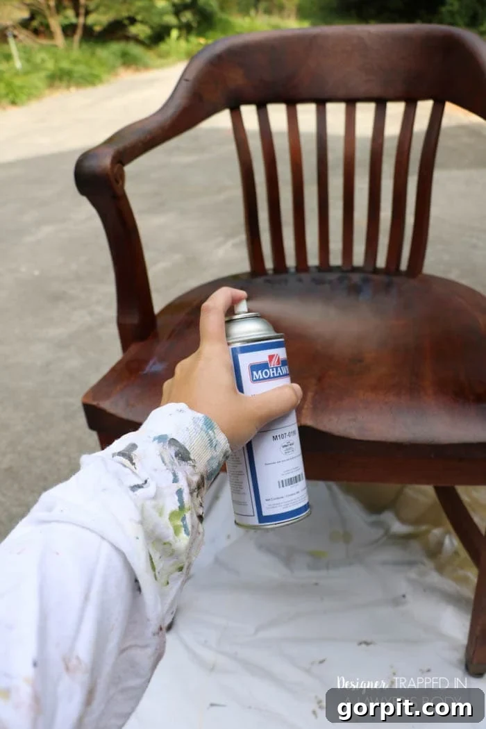 Revitalize Your Wood Chairs Effortlessly 7 Applying Mohawk Wax Wash Remover to an antique wood chair for deep cleaning