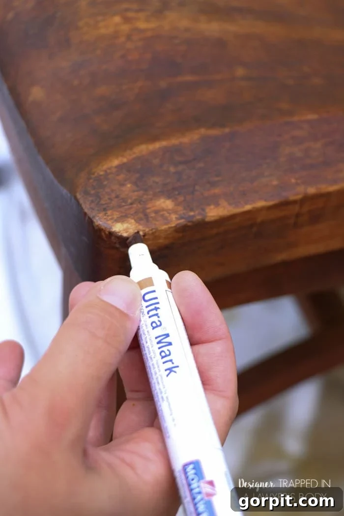 Revitalize Your Wood Chairs Effortlessly 8 Using Mohawk Ultra Touch-Up Marker to repair worn edges on a wood chair