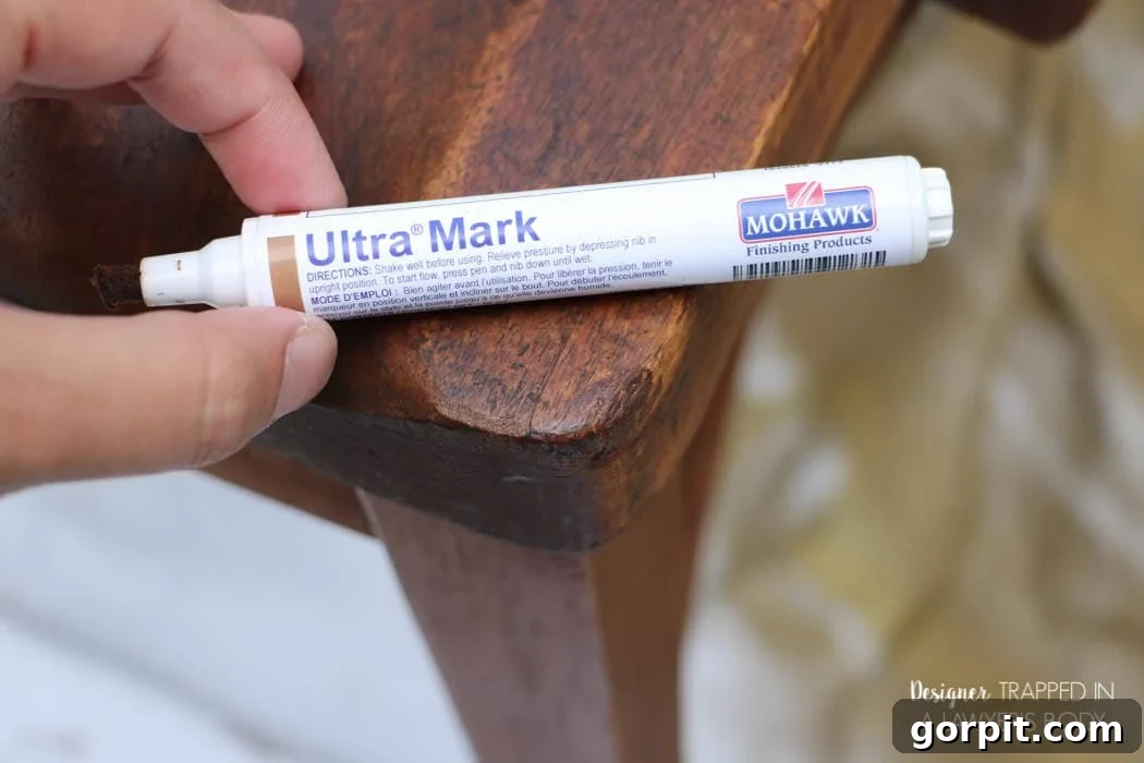 Revitalize Your Wood Chairs Effortlessly 9 Detailed application of a touch-up marker on a wood chair edge